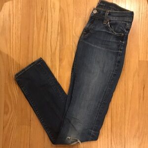 7FAM medium wash skinny jeans with rip